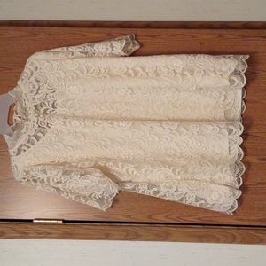 Lacy blouse over silky camisole lining